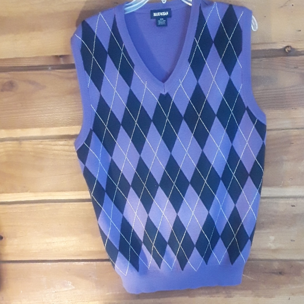 Purple and navy blue sweater vest starts with goin